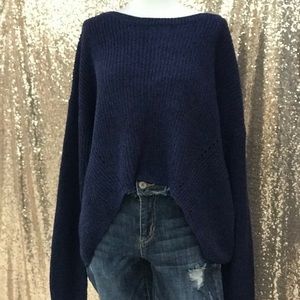 Blue crop sweater w/open back.